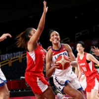 A\'Ja Wilson of the United States goes up against Monica Okoye of Japan on Friday at Saitama Super Arena.  | REUTERS 