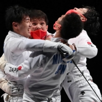 Japan\'s men\'s epee team celebrates after winning gold at Makuhari Messe Hall in Chiba. | AFP-JIJI