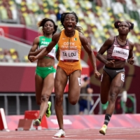 Ivory Coast\'s Marie-Josee Ta Lou reacts as she wins her race in the women\'s 100-meter heats | AFP-JIJI