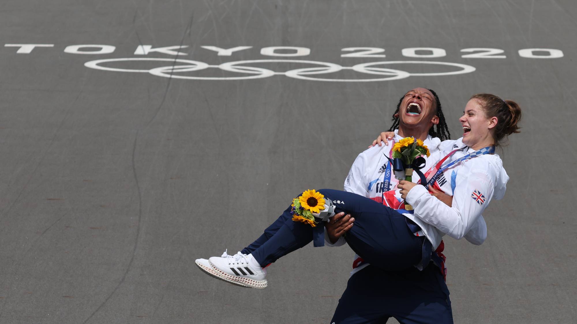 British BMX racers Kye Whyte and Bethany Shriever celebrate after receiving their medals | REUTERS