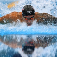 American Caeleb Dressel stormed to the men\'s 100 meter butterfly gold medal on Saturday with a world record time of 49.45 to pick up his second individual gold of the Tokyo Games. | REUTERS