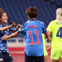 Striker Mana Iwabuchi (left) thinks Japan\'s players may need to consider moves overseas in order to improve. | REUTERS