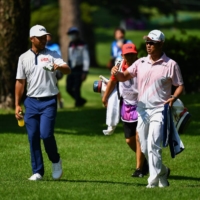 Japan\'s Hideki Matsuyama talks with American Xander Schauffele during their third round at the Kasumigaseki Country Club in Kawagoe, Saitama Prefecture, on Saturday.  | AFP-JIJI