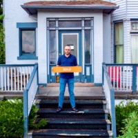 Landlord Richard Tyson stands in front of a five-unit apartment building, which he recently sold to an out-of-state investor, in Rochester, New York.  | MARK PRIOR / VIA REUTERS  
