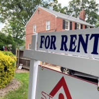 A sign in front of a home in Arlington, Virginia, in June | REUTERS