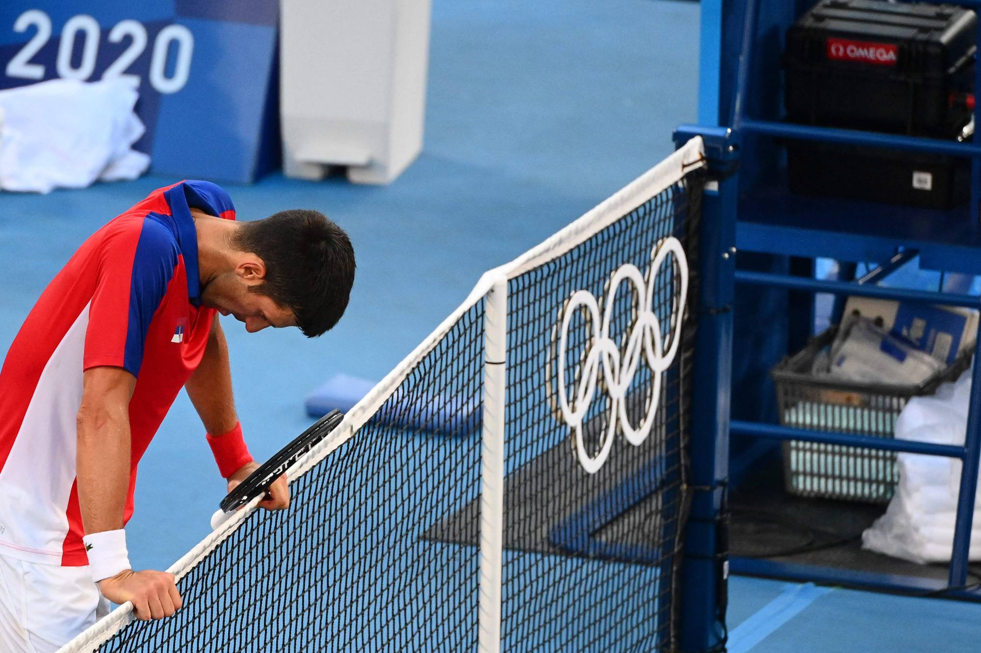 Spain s Pablo Carreno Busta beats listless Novak Djokovic for
