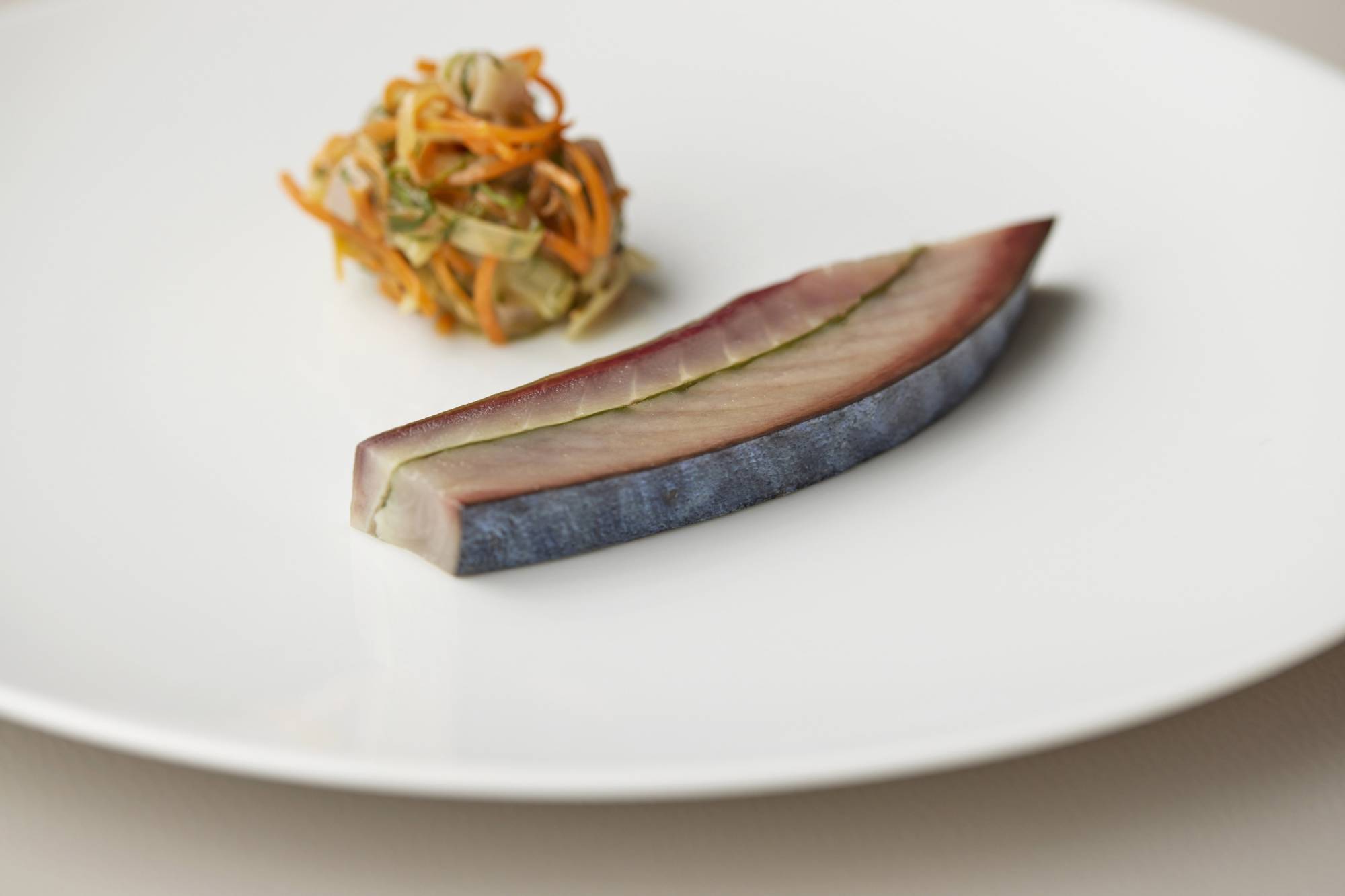 Currently on the menu at Sezanne is an escabeche of saba (mackerel) that has been vinegar washed and lightly smoked, then served with an incision of Thai basil. | FOUR SEASONS HOTEL TOKYO AT MARUNOUCHI 
