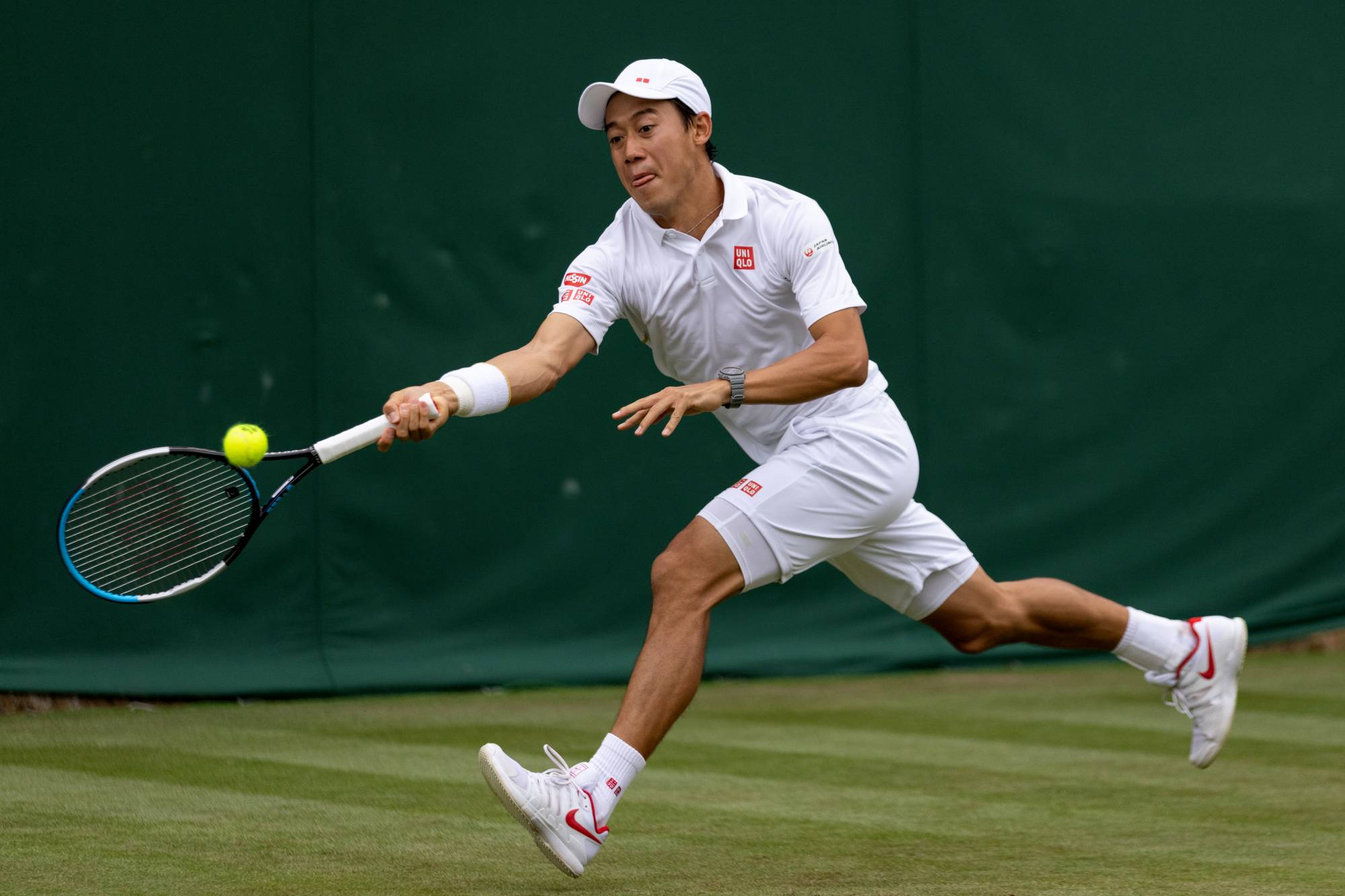 Kei Nishikori reaches second round at Wimbledon with 100th Grand ...