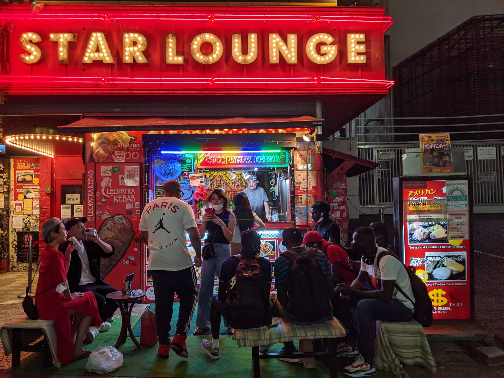 The wooden benches outside Cleopatra Kebab are a hub for club owners, inebriated bar patrons and Twitch-streamers alike. | W. TANNER KIRK