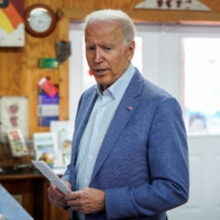 President Joe Biden speaks to the media at King Orchards in Central Lake, Michigan, on Saturday. | REUTERS