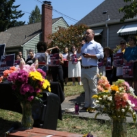 A vigil is held for Guatemalan-born farm-worker Sebastian Francisco Perez, 38, outside the Guatemalan Honorary Consulate in Portland, Oregon, on Saturday. Perez died during the heat wave a week ago in Marion County while moving field irrigation lines in St. Paul, Oregon. | REUTERS 