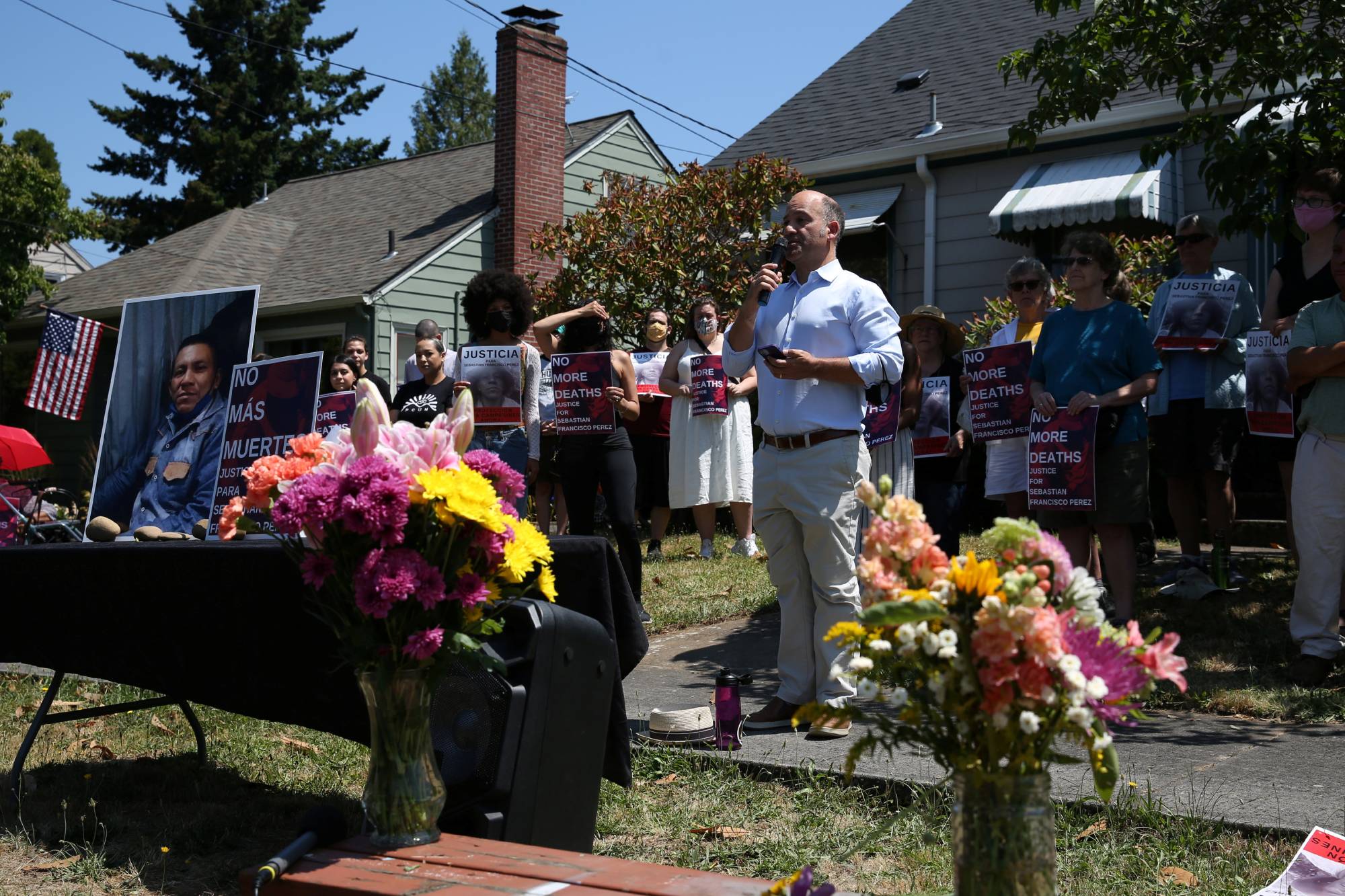 A vigil is held for Guatemalan-born farm-worker Sebastian Francisco Perez, 38, outside the Guatemalan Honorary Consulate in Portland, Oregon, on Saturday. Perez died during the heat wave a week ago in Marion County while moving field irrigation lines in St. Paul, Oregon. | Reuters 