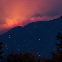 A wildfire burns above the Fraser River Valley near Lytton, British Columbia, Canada, on Friday. | BLOOMBERG 