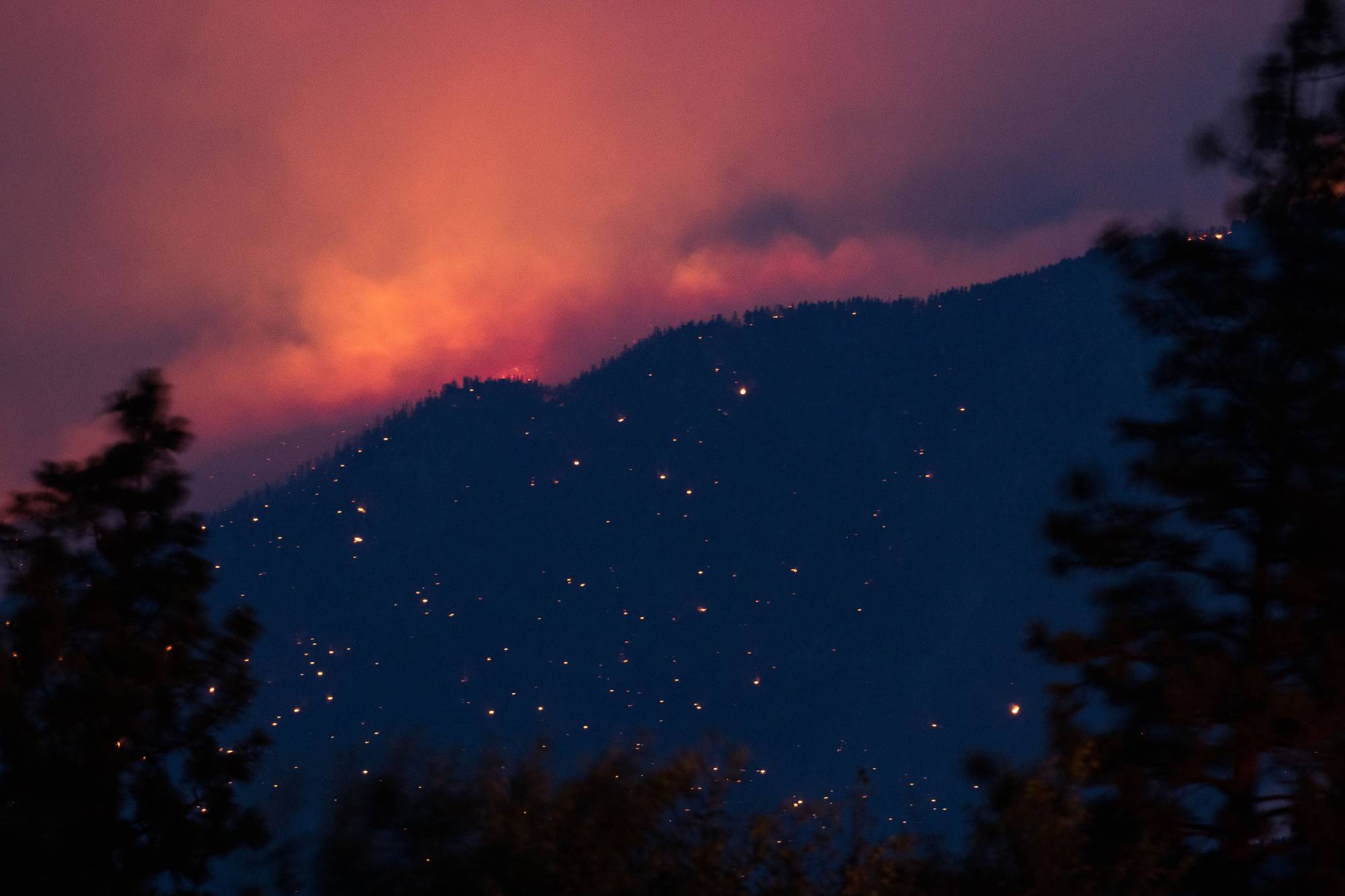 A wildfire burns above the Fraser River Valley near Lytton, British Columbia, Canada, on Friday. | Bloomberg 