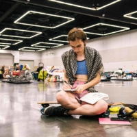 A woman rests at the Oregon Convention Center cooling station in Portland on June 28 amid a heat wave that moved over much of the United States and Canada. | AFP-JIJI