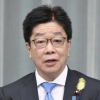 Chief Cabinet Secretary Katsunobu Kato speaks at a news conference in Tokyo on Monday.  | KYODO