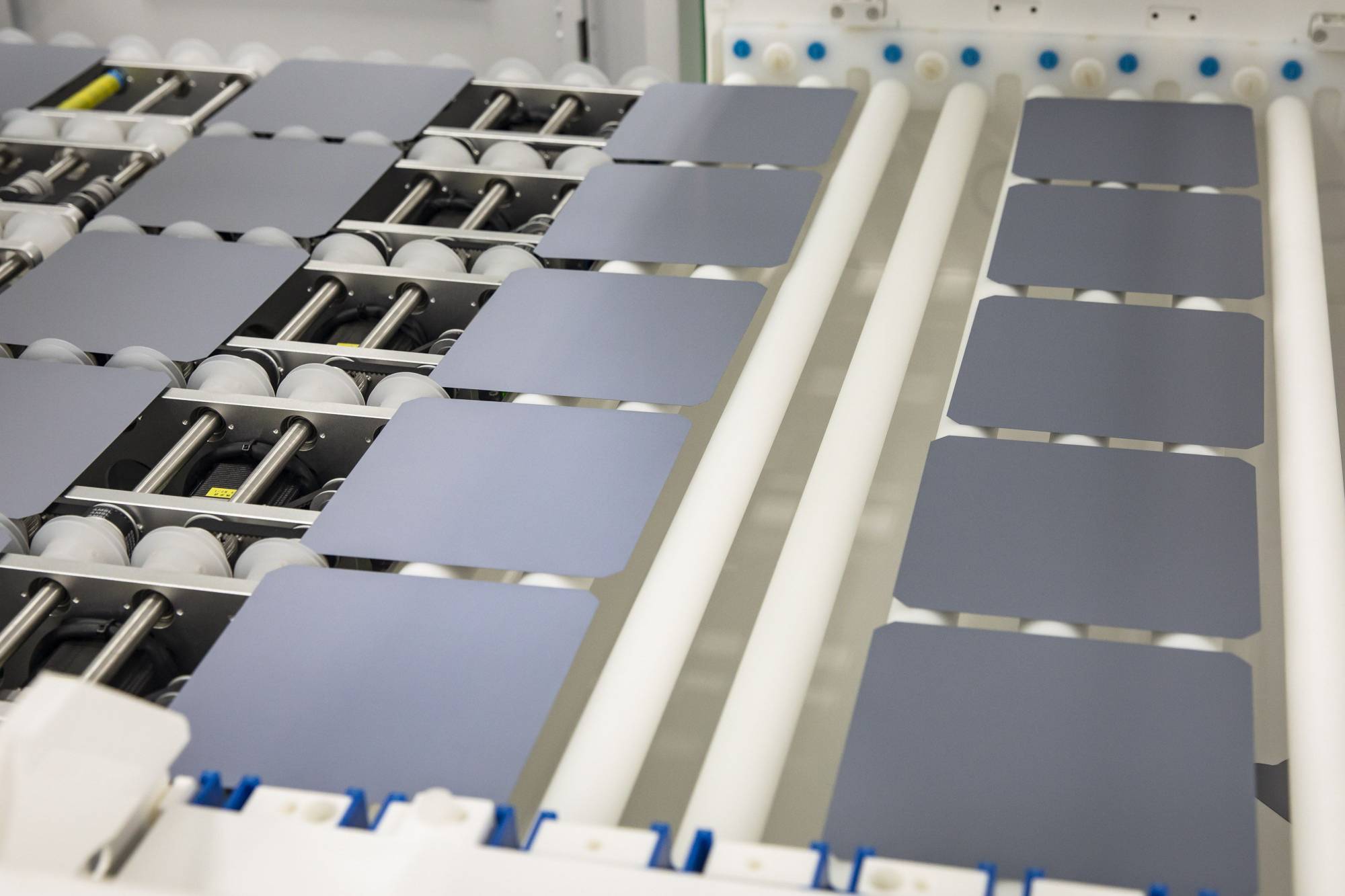 Monocrystalline silicon wafers like these become either n-type or p-type materials depending on which chemicals they're doped with.  | Bloomberg 