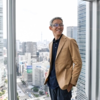 Recruit Holdings CEO Hisayuki Idekoba poses at the firm\'s headquarters in Tokyo during a recent interview. | BLOOMBERG