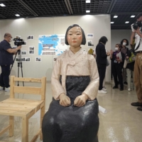 A statue symbolizing \"comfort women\" is put on display at an art exhibition at the Sakae municipal gallery in Nagoya on Tuesday.  | KYODO
