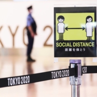 A social distancing sign at Haneda Airport in Tokyo on Thursday | REUTERS