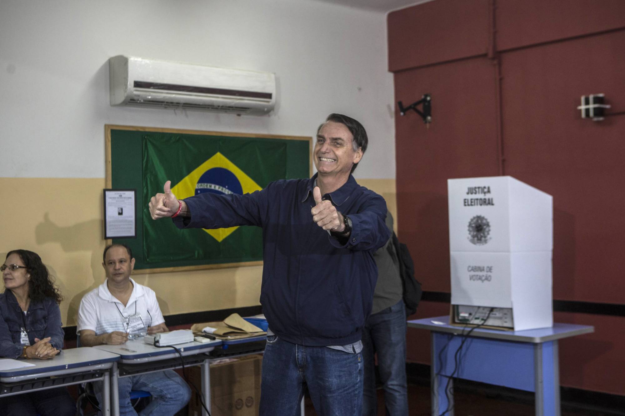 Jair Bolsonaro casts his ballot during the first round of presidential elections in Rio de Janeiro in 2018. | BLOOMBERG 