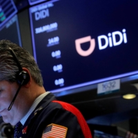 A trader works during the IPO for Chinese ride-hailing company Didi Global Inc. on the New York Stock Exchange floor on June 30. | REUTERS 