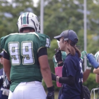 Kyoto Prefectural University offensive coordinator Momoe Tani calls a play during a game. | COURTESY OF MOMOE TANI