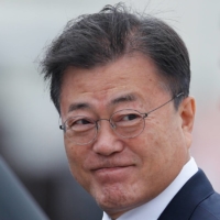 The likelihood of a visit by South Korea\'s President Moon Jae-in to Tokyo for the Olympics has been a matter of debate in recent weeks. | POOL / VIA REUTERS