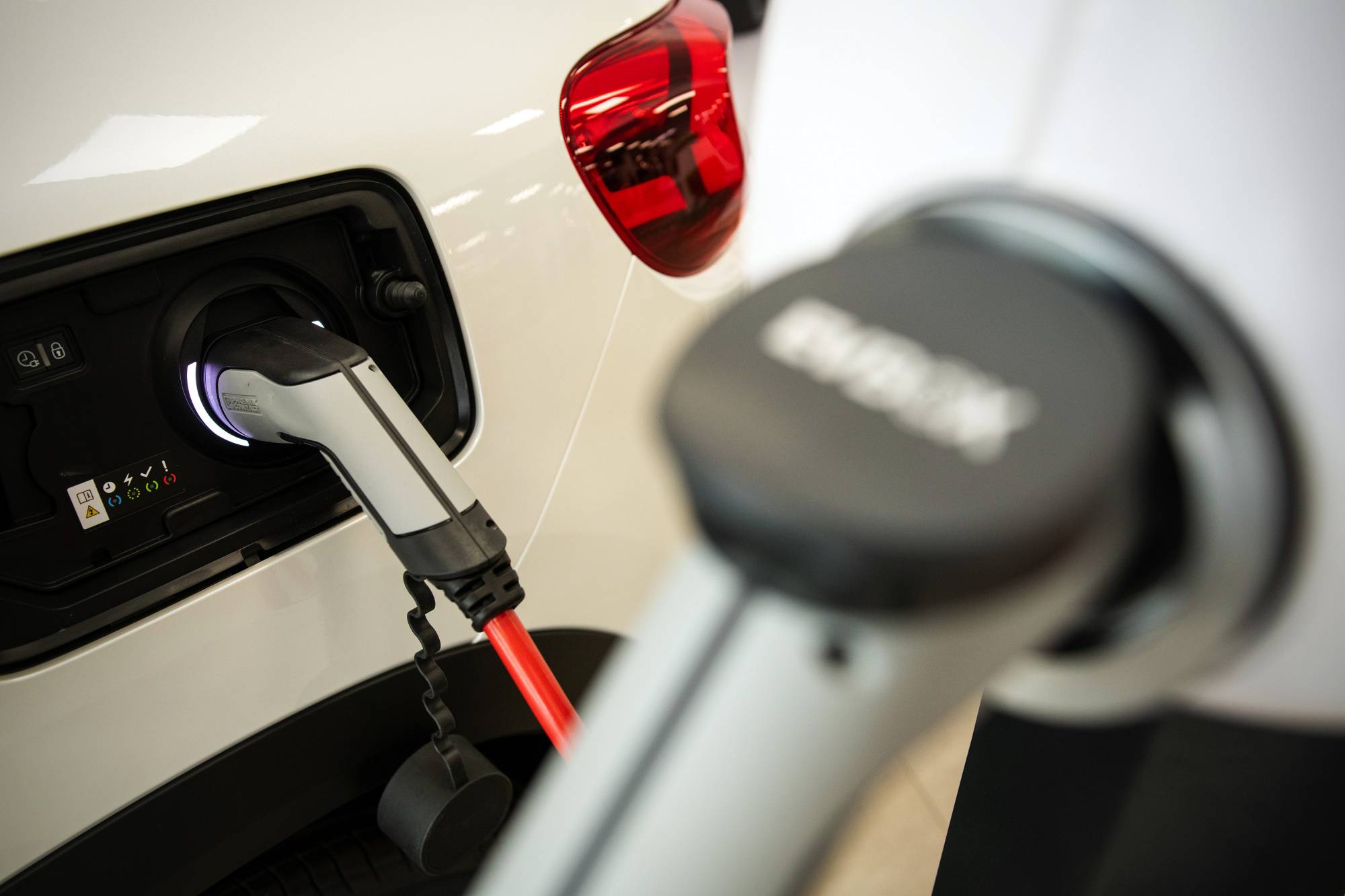 A Citroen C5 Aircross hybrid sports utility vehicle charges at a Citroen automobile showroom in Paris on Thursday. The EU on Wednesday laid out proposals that would consign the internal combustion engine to history. | Bloomberg