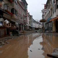 A flooded street in Ahrweiler-Bad Neuenahr, Germany, on Thursday. Voter surveys across Europe — which this week suffered deadly flash floods after record rainfall that some officials linked to global warming — show that climate change is a growing preoccupation among many of its citizens. | AFP-JIJI