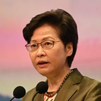 Hong Kong\'s Chief Executive Carrie Lam speaks at her weekly news conference at the government headquarters in Hong Kong on July 6. Lam told reporters Tuesday that it would be \"too harsh” to expect officials to know every detail about a dinner before accepting. | AFP-JIJI