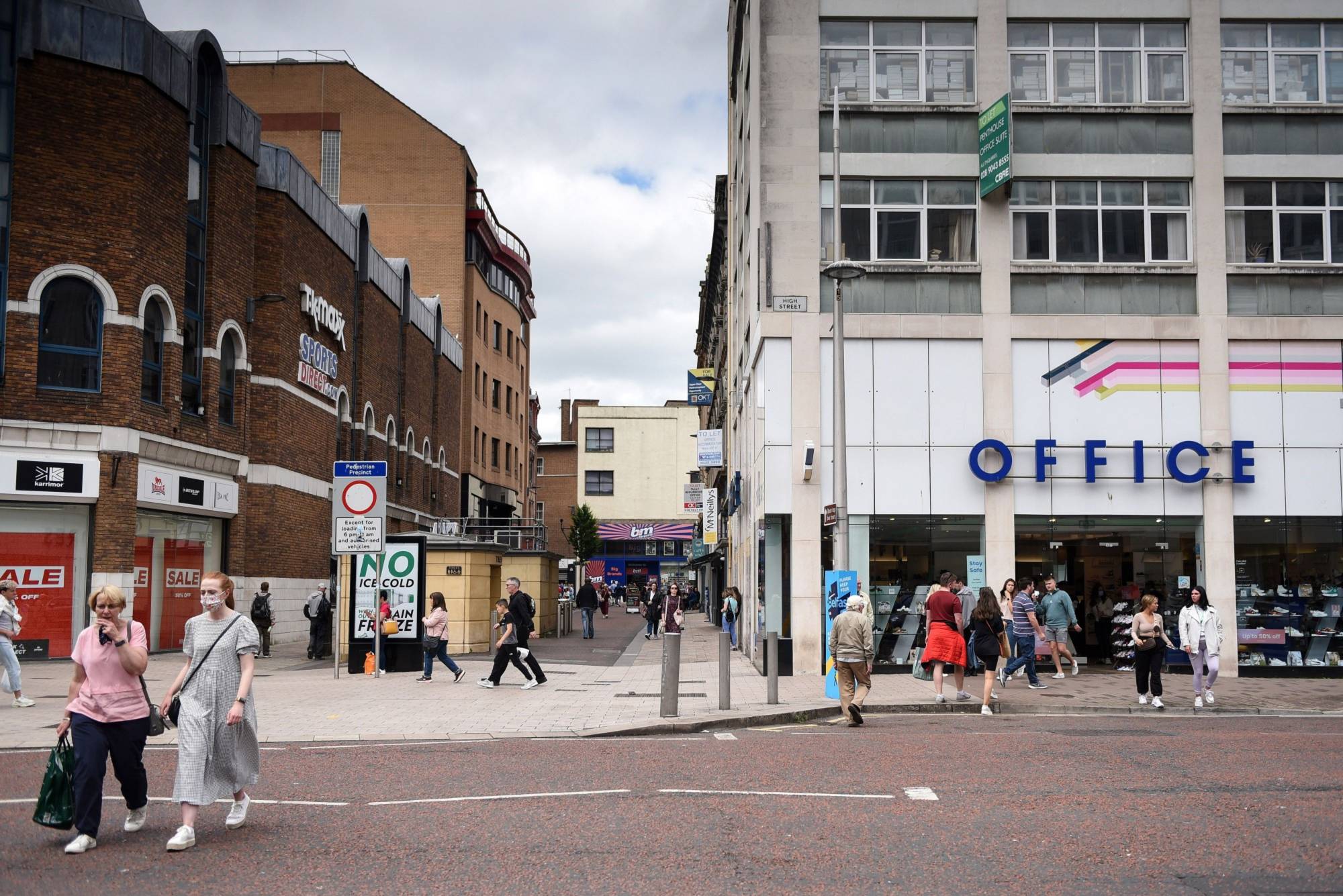 While bonfires are built and marches get under way, people are out shopping on a Friday afternoon like in any U.K. town or city. | Bloomberg 
