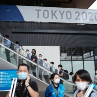 Members of the press attend a tour of the Olympic and Paralympic Village, a 44-hectare complex on the city’s Harumi area near Tokyo Bay, in June. | RYUSEI TAKAHASHI
