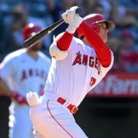 Angels designated hitter Shohei Ohtani hits a two-run home run for his 34th of the season against the Seattle Mariners at Angel Stadium in Anaheim, California on Sunday. | USA TODAY /  VIA REUTERS 