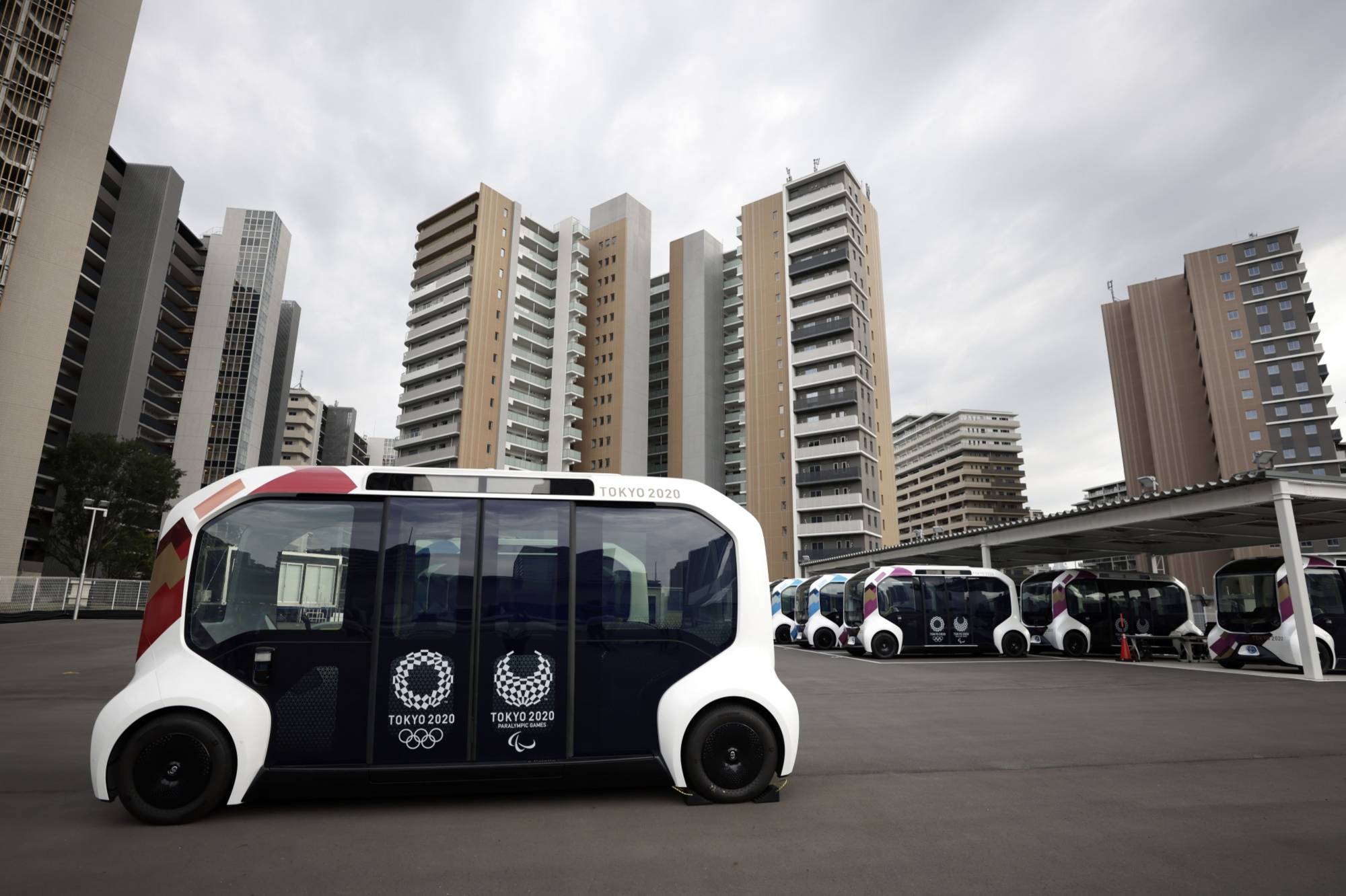 Toyota’s e-Palette autonomous electric vehicles at the Olympic and Paralympic Village in Tokyo. | Bloomberg