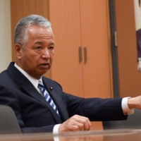 Akira Amari, tax chief of the ruling Liberal Democratic Party and former economy minister, says Japanese technology firms have been content to focus on the domestic market without venturing out into the world. | BLOOMBERG