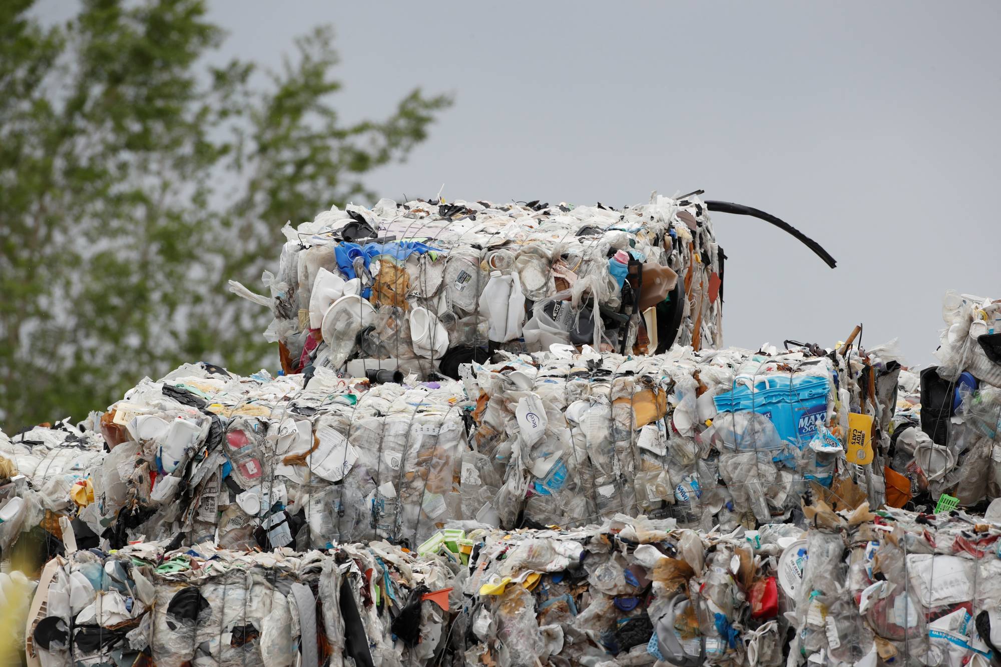 Bales of hard-to-recycle plastic waste are seen piled up at Renewlogy Technologies in Salt Lake City, Utah, on May 17. | REUTERS