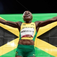 Jamaica\'s Elaine Thompson-Herah celebrates after winning the women\'s 100-meter final at National Stadium on Saturday.  | AFP-JIJI