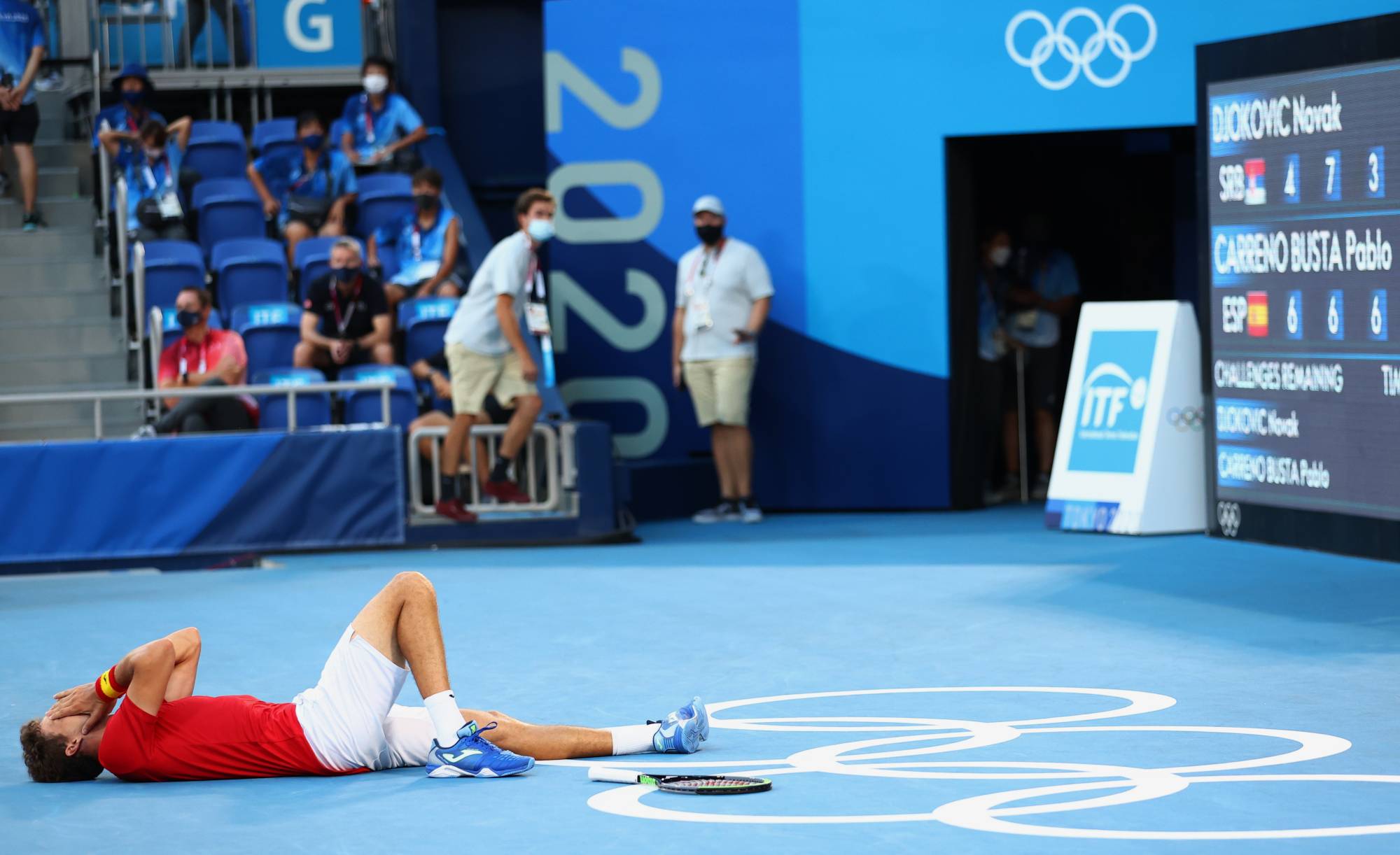 Pablo Carreno of Spain celebrates after winning his bronze medal match against Novak Djokovic of Serbia on Saturday at Ariake Tennis Park.  | REUTERS