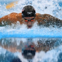 American Caeleb Dressel stormed to the men\'s 100 meter butterfly gold medal on Saturday with a world record time of 49.45 to pick up his second individual gold of the Tokyo Games. | REUTERS