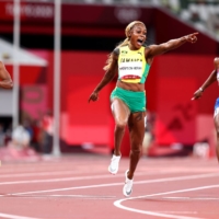 Elaine Thompson-Herah of Jamaica celebrates after winning gold in the women\'s 100-meter. | REUTERS