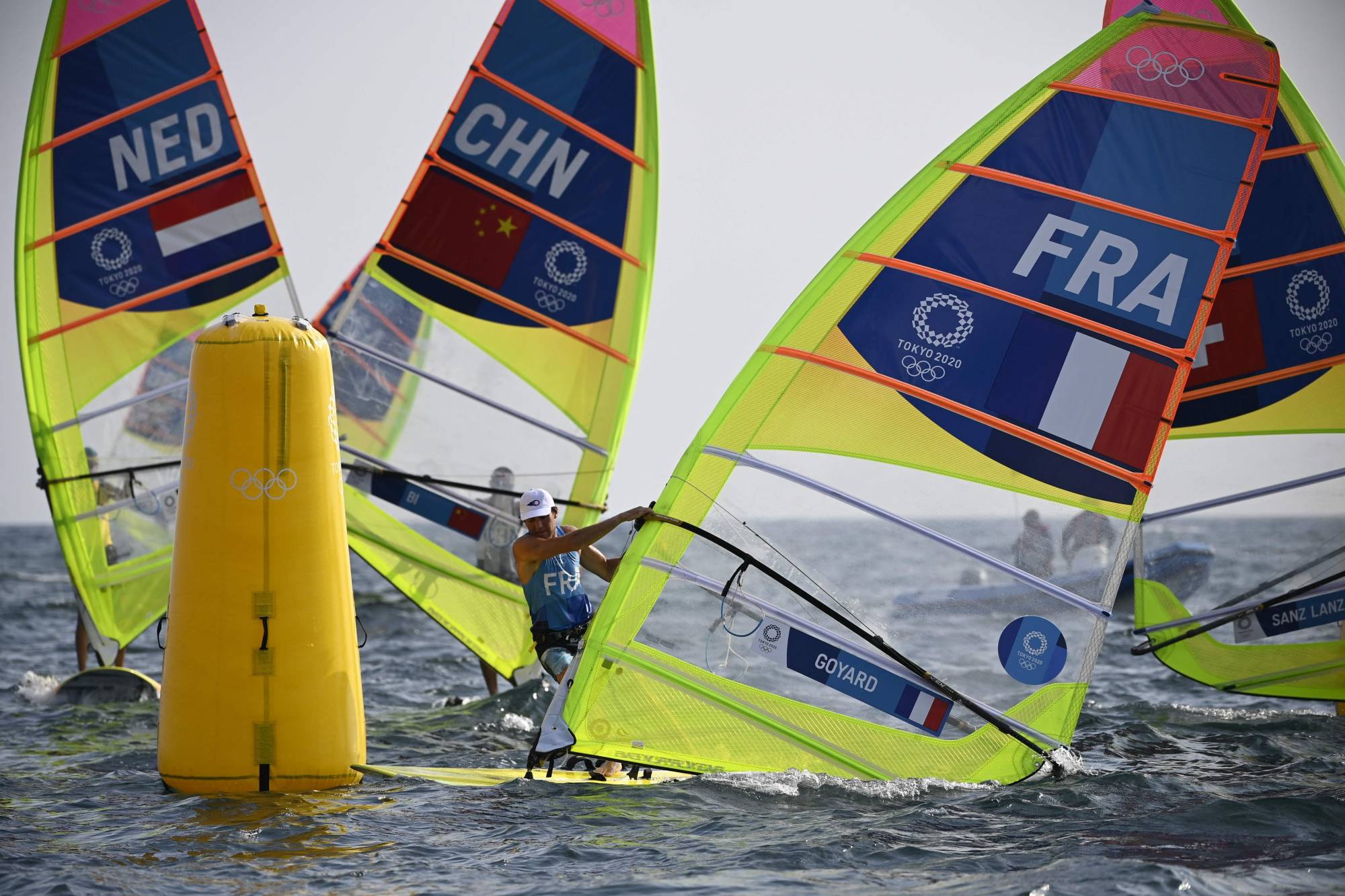 A scene from the men's windsurfer RS:X medal race sailing competition at the Enoshima Yacht Harbour in Fujisawa, Kanagawa Prefecture | AFP-JIJI