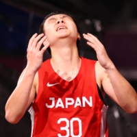 Keisei Tominaga reacts after Japan lost its quarterfinal match to Latvia at Aomi Urban Sports Park in Tokyo on Tuesday.  | REUTERS