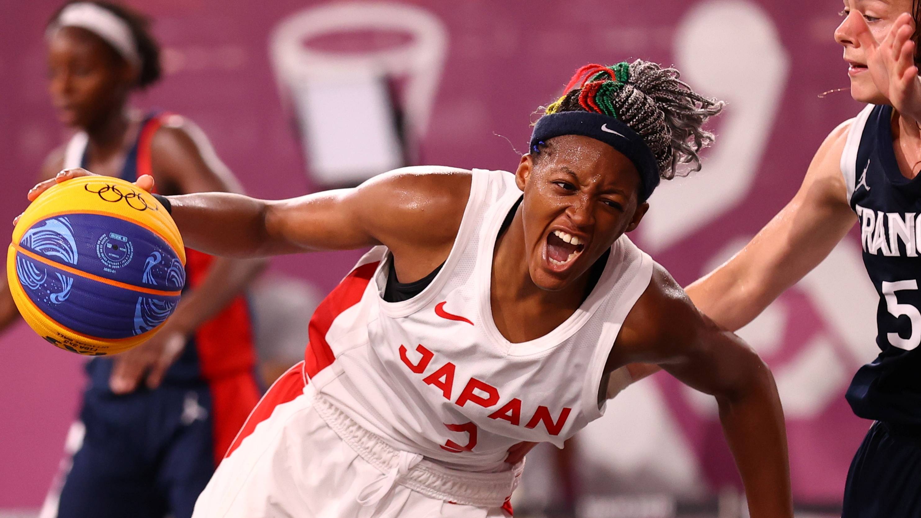 Stephanie Mawuli of Japan drives past a French defender during a quarterfinal match on Tuesday. | Reuters