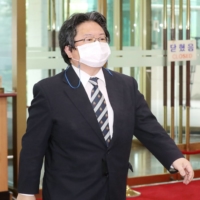 Hirohisa Soma, the deputy chief of mission at the Japanese Embassy in Seoul, enters South Korea\'s Foreign Ministry in Seoul on July 13. | YONHAP NEWS AGENCY / VIA KYODO