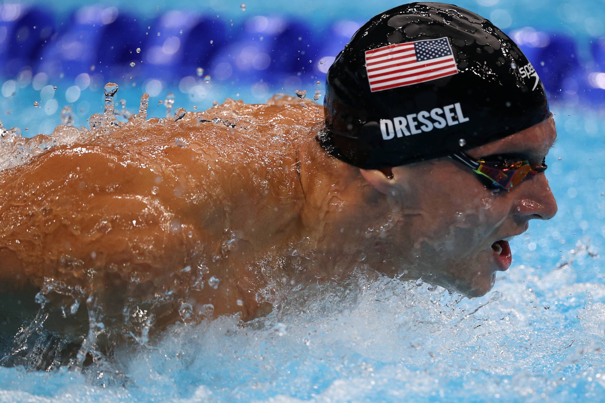 Caeleb Dressel swims the butterfly leg of the men's 4x100-meter medley relay on Sunday. | Reuters