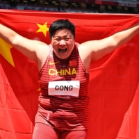 China\'s Gong Lijiao celebrates after winning gold in the women\'s shot put on Sunday at National Stadium.  | REUTERS