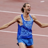 Gianmarco Tamberi of Italy celebrates after winning gold on Sunday. | REUTERS