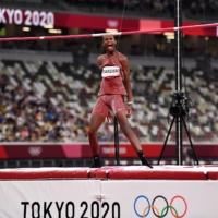 Qatar\'s Mutaz Essa Barshim reacts as he competes in the men\'s high jump final during the Tokyo 2020 Olympic Games at the Olympic Stadium in Tokyo on Sunday. | AFP-JIJI