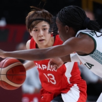 Japan\'s Rui Machida dribbles the ball past Nigeria\'s Promise Amukamara in the two nations\' Group B Olympic match at Saitama Super Arena on Monday.  | AFP-JIJI